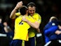 John O'Shea and Phil Bardsley of Sunderland celebrate following their team's 2-1 victory following the penalty shootout during the Capital One Cup semi final against Man Utd on January 22, 2014