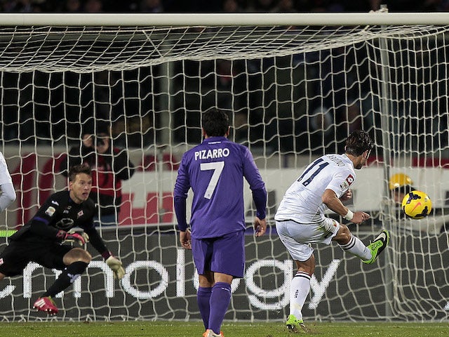 Alberto Gilardino of Genoa CFC scores the opening goal during the Serie A match between ACF Fiorentina and Genoa CFC at Stadio Artemio Franchi on January 26, 2014