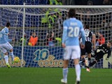 Lazio's midfielder Antonio Candreva (L) scores a penalty kick during the Italian Serie A football match Lazio vs Juventus at Olympic stadium in Rome on January 25, 2014