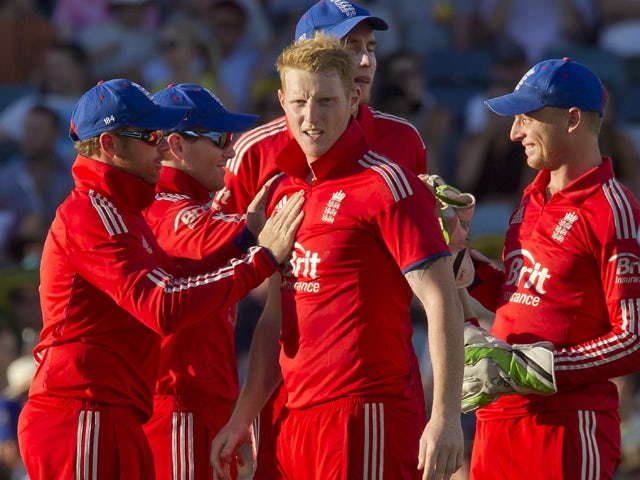 England's bowler Ben Stokes celebrates with teammates Jafter dismissing Australian batsman Glenn Maxwell during the fourth one day international cricket match of the series between Australia and England in Perth on January 24, 2014