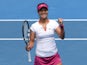 China's Li Na celebrates after victory in her women's singles match against Italy's Flavia Pennetta on day nine at the 2014 Australian Open tennis tournament in Melbourne on January 21, 2014