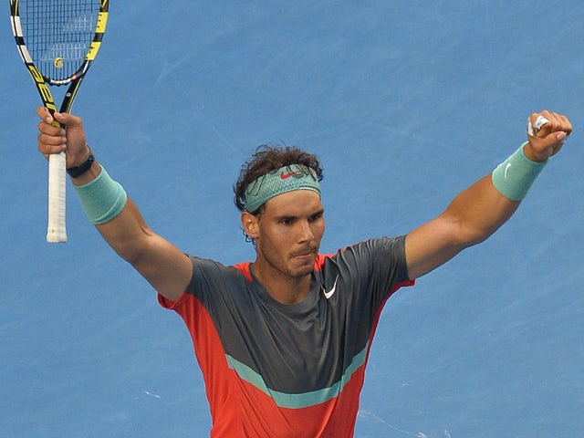 Spain's Rafael Nadal celebrates after victory in his men's singles match against Japan's Kei Nishikori on day eight of the 2014 Australian Open tennis tournament in Melbourne on January 20, 2014