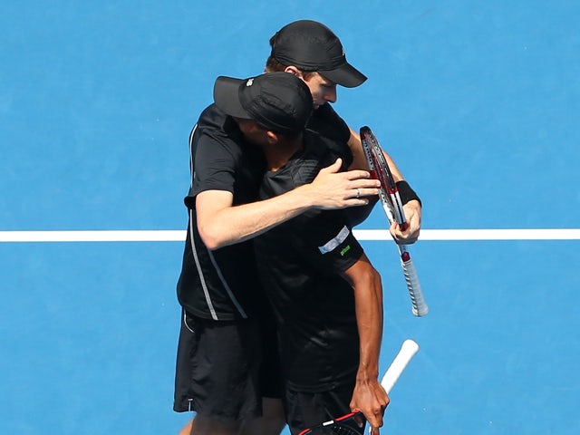 Eric Butorac of the United States and Raven Klaasen of South Africa celebrate winning their third round doubles match against Mike Bryan of the United States and Bob Bryan of the United States during day eight of the 2014 Australian Open at Melbourne Park