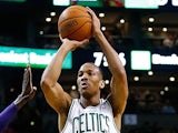  Avery Bradley of the Boston Celtics takes a shot against the Los Angeles Lakers in the first quarter during the game at TD Garden on January 17, 2014