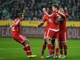 Bayern Munich's midfielder Thomas Muller and his teammates celebrate during the German first division Bundesliga football match Borussia Monchengladbach vs FC Bayern Munich in the German city of Moenchengladbach on January 24, 2014
