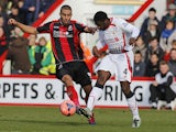 Bournemouth's Lewis Grabban vies with Liverpool's Ivorian defender Kolo Toure during the English FA Cup fourth round football match between AFC Bournemouth and Liverpool at Dean Court in Bournemouth on January 25, 2014
