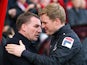 Manager Eddie Howe of Bournemouth greets Manager Brendan Rodgers of Liverpool during the FA Cup Fourth Round match between Bournemouth and Liverpool at Goldsands Stadium on January 25, 2014