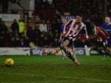 Marcello Trotta scores a goal for Brentford during the Sky Bet League One match between Brentford and Gillingham at Griffin Park on January 24, 2014
