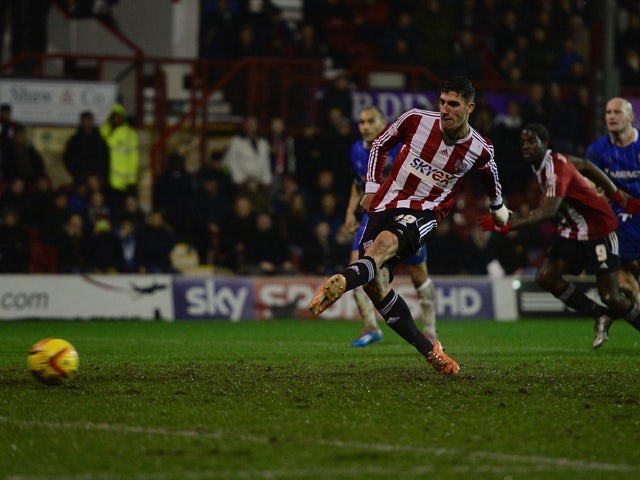 Marcello Trotta scores a goal for Brentford during the Sky Bet League One match between Brentford and Gillingham at Griffin Park on January 24, 2014