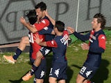 Marco Sau of Cagliari celebrates with teammates after scoring the opening goal during the Serie A match between Cagliari Calcio and AC Milan at Stadio Sant'Elia on January 26, 2014