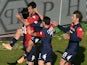 Marco Sau of Cagliari celebrates with teammates after scoring the opening goal during the Serie A match between Cagliari Calcio and AC Milan at Stadio Sant'Elia on January 26, 2014