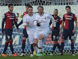 AC Milan's forward Giampaolo Pazzini celebrates after scoring during the Italian Serie A football match between Cagliari and AC Milan on January 26, 2014