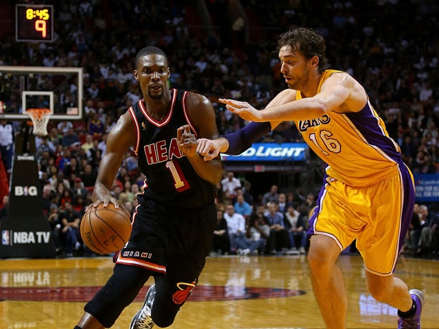Chris Bosh #1 of the Miami Heat posts up Pau Gasol #16 of the Los Angeles Lakers during a game at American Airlines Arena on January 23, 2014