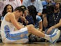 Danilo Gallinari of the Denver Nuggets grimaces as he injures his left leg and was forced to leave the game against the Dallas Mavericks at the Pepsi Center on April 4, 2013