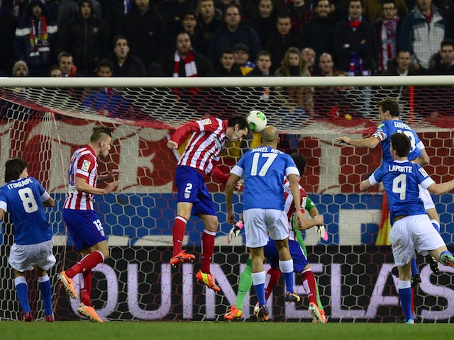 Atletico Madrid's Uruguayan defender Diego Godin scores during the Spanish league football match Atletico Madrid vs Athletic Club Bilbao at the Vicente Calderon stadium in Madrid on January 23, 2014