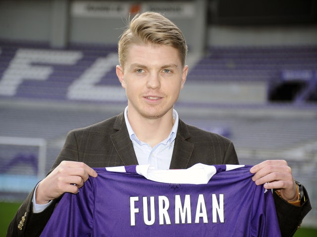 Polish midfielder Dominik Furman poses with his new Toulouse jersey on January 16, 2014