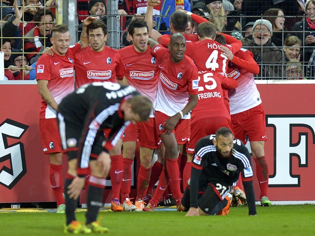 Freiburg's players celebrate after teammate midfielder Felix Klaus scored the winning goal for their 3-2 victory in the German first division Bundesliga football match SC Freiburg vs Bayer 04 Leverkusen in Freiburg, southwestern Germany, on January 25, 20