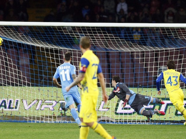 Genaro Sardo of Chievo Verona scores a goal during the Italian Serie A football match SSC Napoli vs AC Chievo Verona at San Paolo Stadium on January 25, 2014