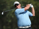 George Coetzee of South Africa plays his second shot on the ninth hole during the second round of the Commercial Bank Qatar Masters at Doha Golf Club on January 23, 2014
