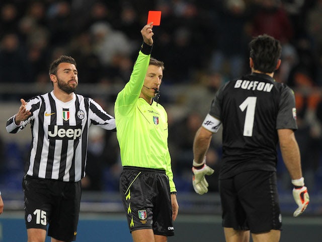 Referee Davide Massa shows the red card to Gianluigi Buffon of Juventus during the Serie A match between S.S. Lazio and Juventus at Stadio Olimpico on January 25, 2014