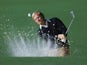 Jack Nicklaus of the USA chips out of the sand bunker during the US Masters Golf Tournament on April 12, 1986 at the Augusta National Golf Club in Augusta, Georgia, USA