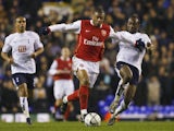 Julio Baptista of Arsenal is challenged by Didier Zokora of Tottenham during the Carling Cup Semi Final 1st leg match on January 24, 2007