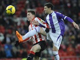 Athletic Bilbao's Kike Sola and Real Valladolid's Oscar Gonzalez in action during their La Liga match on January 20, 2014