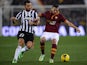 AS Roma's Brazilian defender Leandro Castan fights for the ball against Juventus' forward Fabio Quaglierella during their Coppa Italia football match, on January 21 , 2014