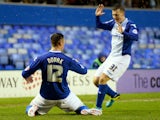 Lee Novak of Birmingham celebrates with teammate Paul Caddis after scoring the opening goal during the FA Cup fourth round match against Swansea City on January 25, 2014