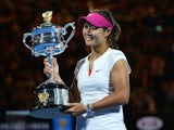China's Li Na holds the trophy after her victory against Slovakia's Dominika Cibulkova during the women's singles final on day 13 of the 2014 Australian Open tennis tournament in Melbourne on January 25, 2014