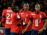 Lille's Ivorian forward Salomon Kalou is congratuled by Lille's Senegalese midfielder Idrissa Gueye after scoring a goal during the French L1 football match Lille vs Rennes on January 24, 2014