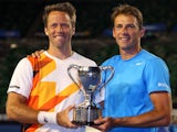 Lukasz Kubot and Robert Lindstedt celebrate with the trophy after winning the men's doubles final against Eric Butorac and Raven Klaasen on January 25, 2014