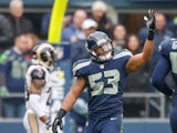 Linebacker Malcolm Smith #53 of the Seattle Seahawks celebrates after scoring a touchdown on a pickoff against the St. Louis Rams at CenturyLink Field on December 29, 2013