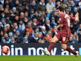 Watford's Italian forward Fernando Forestieri shoots to score a goal during the English FA Cup fourth round football match between Manchester City and Watford at the Etihad Stadium in Manchester on January 25, 2014