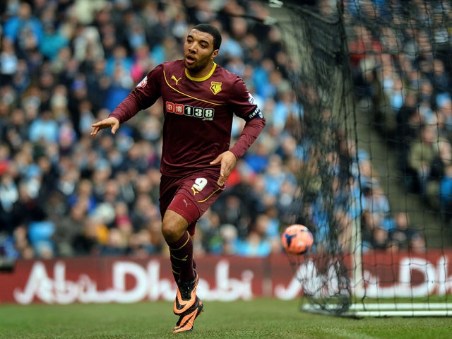 Watford's English forward Troy Deeney celebrates scoring a goal during the English FA Cup fourth round football match between Manchester City and Watford at the Etihad Stadium in Manchester on January 25, 2014