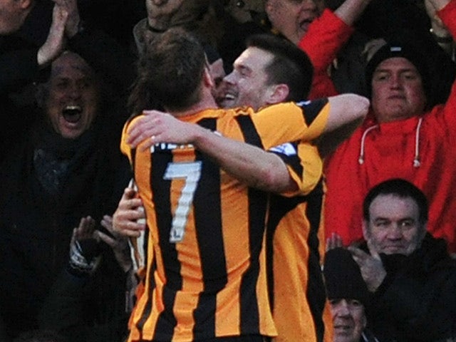 Hull City players celebrate after forward Matty Fryatt scored during the English FA Cup fourth round football match against Southend United on January 25, 2014