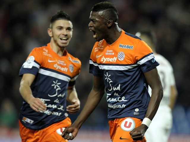 Montpellier's French forward Mbaye Niang (R) reacts after scoring a goal during the French L1 football match Montpellier vs Nice at Mosson stadium in Montpellier, southern France, on January 25, 2014