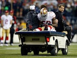 Linebacker NaVorro Bowman #53 of the San Francisco 49ers is carted off the field in the fourth quarter against the Seattle Seahawks during the 2014 NFC Championship at CenturyLink Field on January 19, 2014