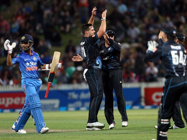 Mitchell McClenaghan from New Zealand celebrates the wicket of India's Ajinkya Rahane during the one day international cricket match between New Zealand and India at Seddon Park in Hamilton on January 22, 2014