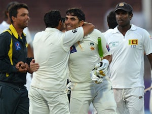 Pakistan cricket team captain Misbah-ul-Haq celebrate with teammates after winning the final day of the third and final cricket Test match against Sri Lanka at the Sharjah International Cricket Stadium, in the Gulf emirate of Shrajah on January 20, 2014