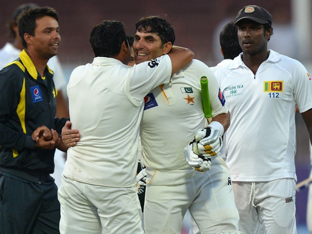 Pakistan cricket team captain Misbah-ul-Haq celebrate with teammates after winning the final day of the third and final cricket Test match against Sri Lanka at the Sharjah International Cricket Stadium, in the Gulf emirate of Shrajah on January 20, 2014