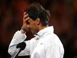 Rafael Nadal of Spain looks on after losing his men's final match against Stanislas Wawrinka of Switzerland during day 14 of the 2014 Australian Open on January 26, 2014