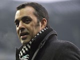 Bremen's head coach Robin Dutt stands on the pitch during a warm-up session prior to the German first division Bundesliga football match Werder Bremen vs Bayern Munich on December 7, 2013