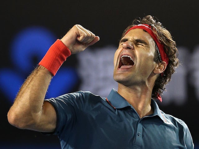 Roger Federer celebrates during the Australian Open quarter-final against Andy Murray in Melbourne on January 22, 2014