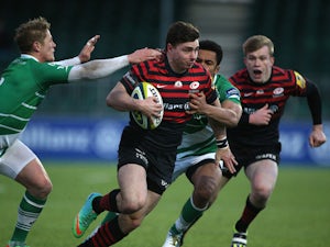 Ben Ransom of Saracens breaks through the Newcastle defence during the LV= Cup match between Saracens and Newcastle Falcons at Allianz Park on January 26, 2014