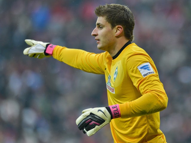 Bremen's German keeper Sebastian Mielitz in action during the German first division Bundesliga football match FC Bayern Munich vs SV Werder Bremen in the southern German city of Munich on February 23, 2013