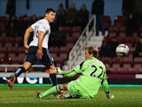Sergio Aguero of Manchester City beats Jussi Jaaskelainen of West Ham United to score their second goal during the Capital One Cup Semi-Final, Second Leg match on January 21, 2014