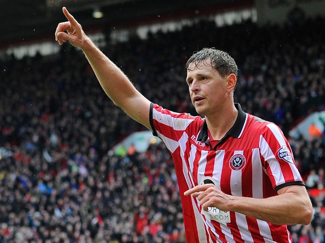 Sheffield United's English forward Chris Porter celebrates after scoring the opening goal during the FA Cup fourth round football match between Sheffield United and Fulham at Bramall Lane in Sheffield, England, on January 26, 2014