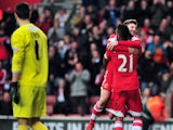 Southampton's Brazilian midfielder Guly Do Prado celebrates scoring a penalty with English midfielder Adam Lallana during the English FA Cup fourth round football match between Southampton and Yeovil Town at St Mary's Stadium in Southampton on January 25,