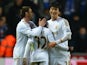 Swansea City's South Korean midfielder Ki Sung-Yueng celebrates with Swansea City's Spanish defender Angel Rangel and Swansea's English forward Nathan Dyer at the final whistle of the English League Cup semi-final second leg football match between Swansea